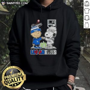 Alt Text: Awesome Charlie Brown fist bump with Snoopy, featuring Los Angeles skyline and Dodgers x Kings hoodie.