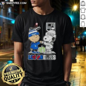 Awesome Charlie Brown fist bump with Snoopy, featuring Los Angeles skyline, Dodgers, and Kings on a trendy T-shirt.