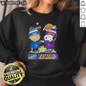Awesome Charlie Brown fist bump with Snoopy in Los Angeles skyline sweatshirt featuring Dodgers and Lakers logos.