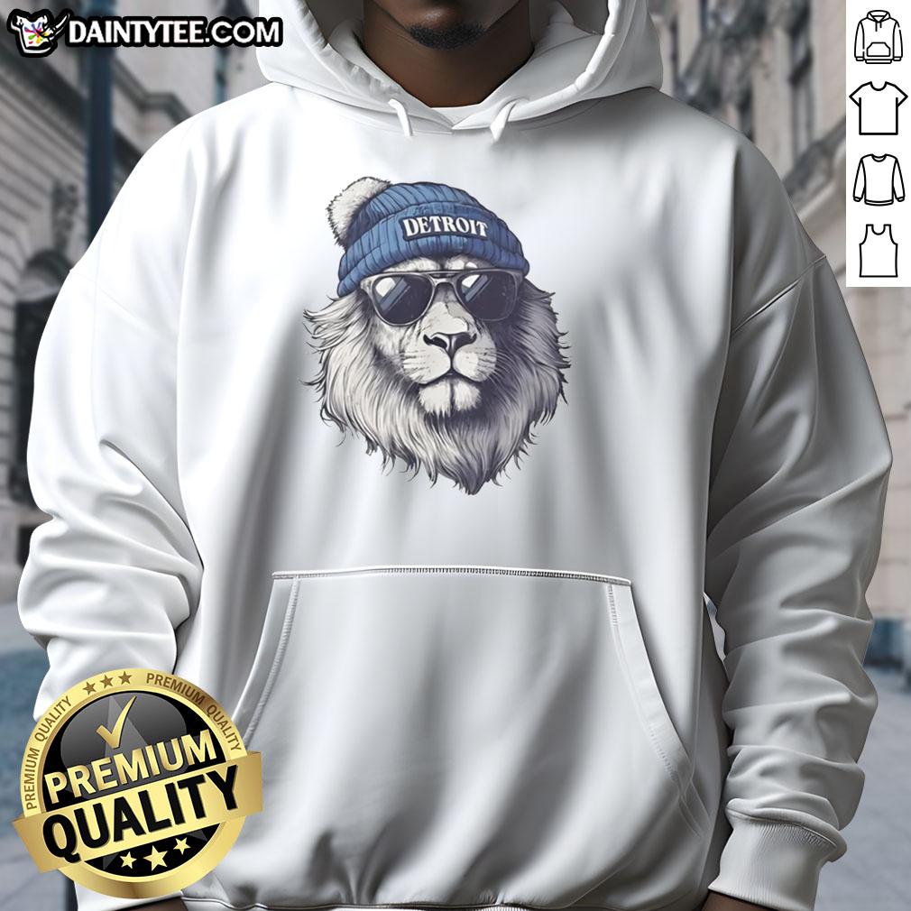 Awesome Detroit Lions mascot wearing a beanie and sunglasses, sporting a hoodie at a football game.