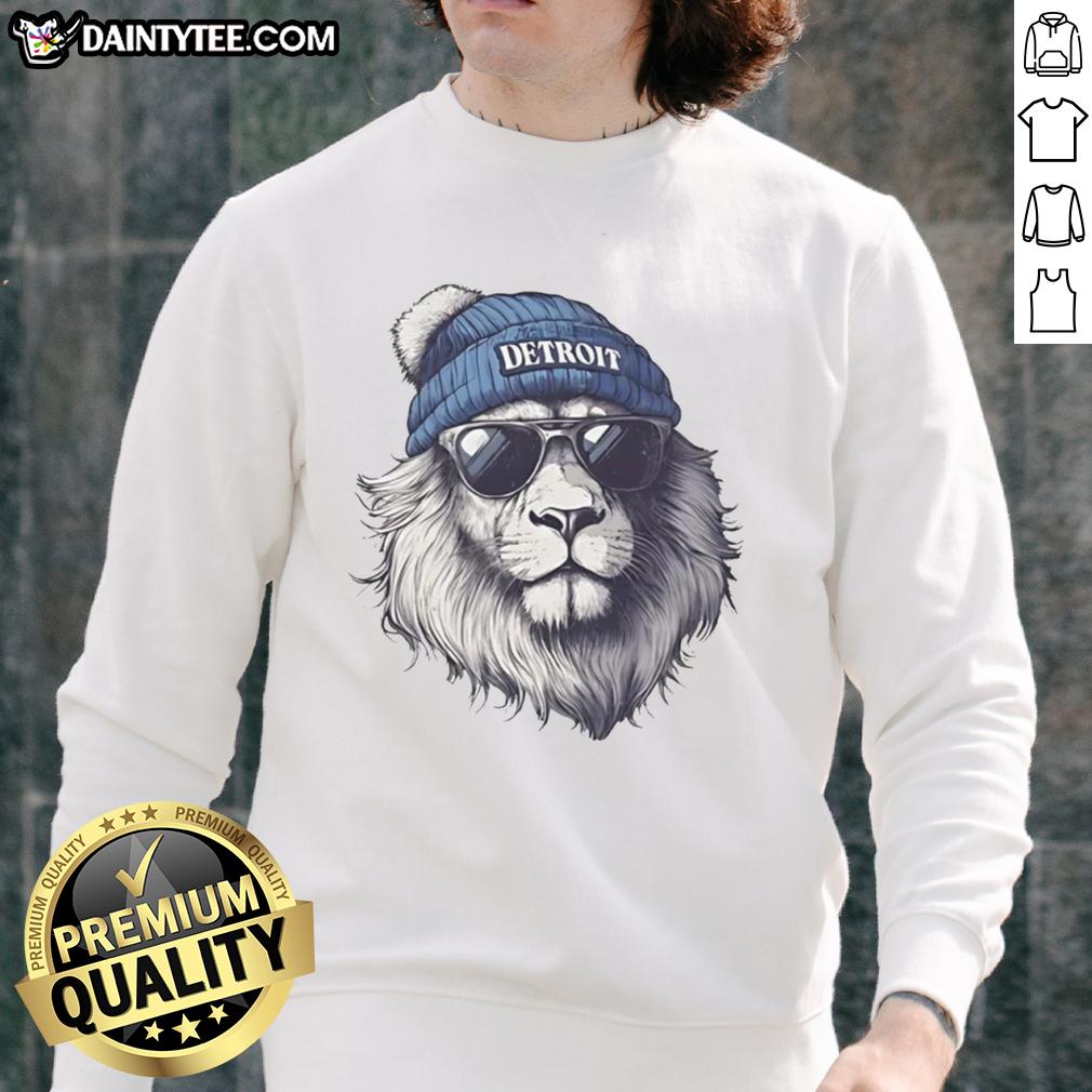 Alt Text: Detroit Lions mascot in a beanie and sunglasses, wearing a sweatshirt, showcasing team spirit and fun.