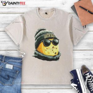 Green Bay Packers mascot in a beanie and sunglasses, wearing a washed t-shirt, ready for game day excitement.