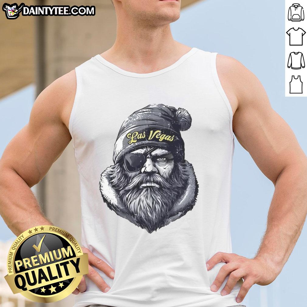 Alt Text: Awesome Las Vegas Raiders mascot wearing a beanie, sunglasses, and a tank top, ready for game day fun.