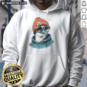 Miami Dolphins mascot in a beanie and sunglasses hoodie, showcasing team spirit and fun in a vibrant setting.