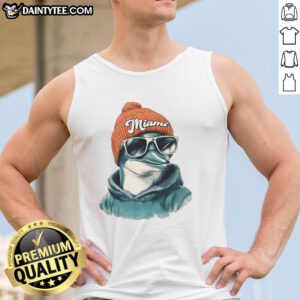 Miami Dolphins mascot in a beanie and sunglasses, wearing a tank top, showcasing team spirit and fun.