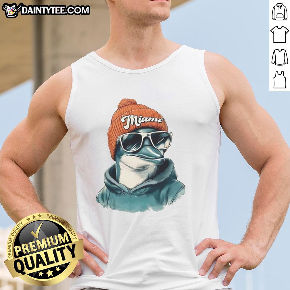 Miami Dolphins mascot in a beanie and sunglasses, wearing a tank top, showcasing team spirit and fun.