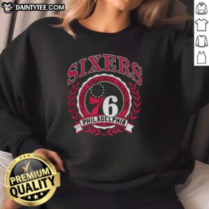 Alt Text: Retro sweatshirt featuring the Philadelphia 76ers NBA logo framed by a laurel wreath, perfect for basketball fans.