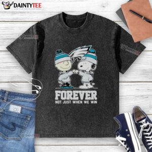 Awesome Philadelphia Eagles Charlie Brown and Snoopy Forever graphic on a washed t-shirt, perfect for fans and casual wear.