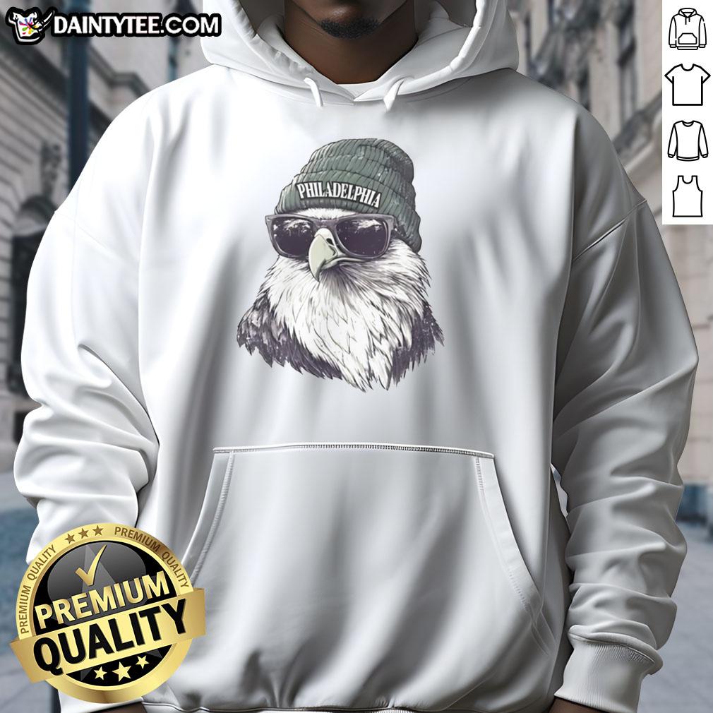 Awesome Philadelphia Eagles mascot in a beanie and sunglasses hoodie, showcasing team spirit and fun during a game.