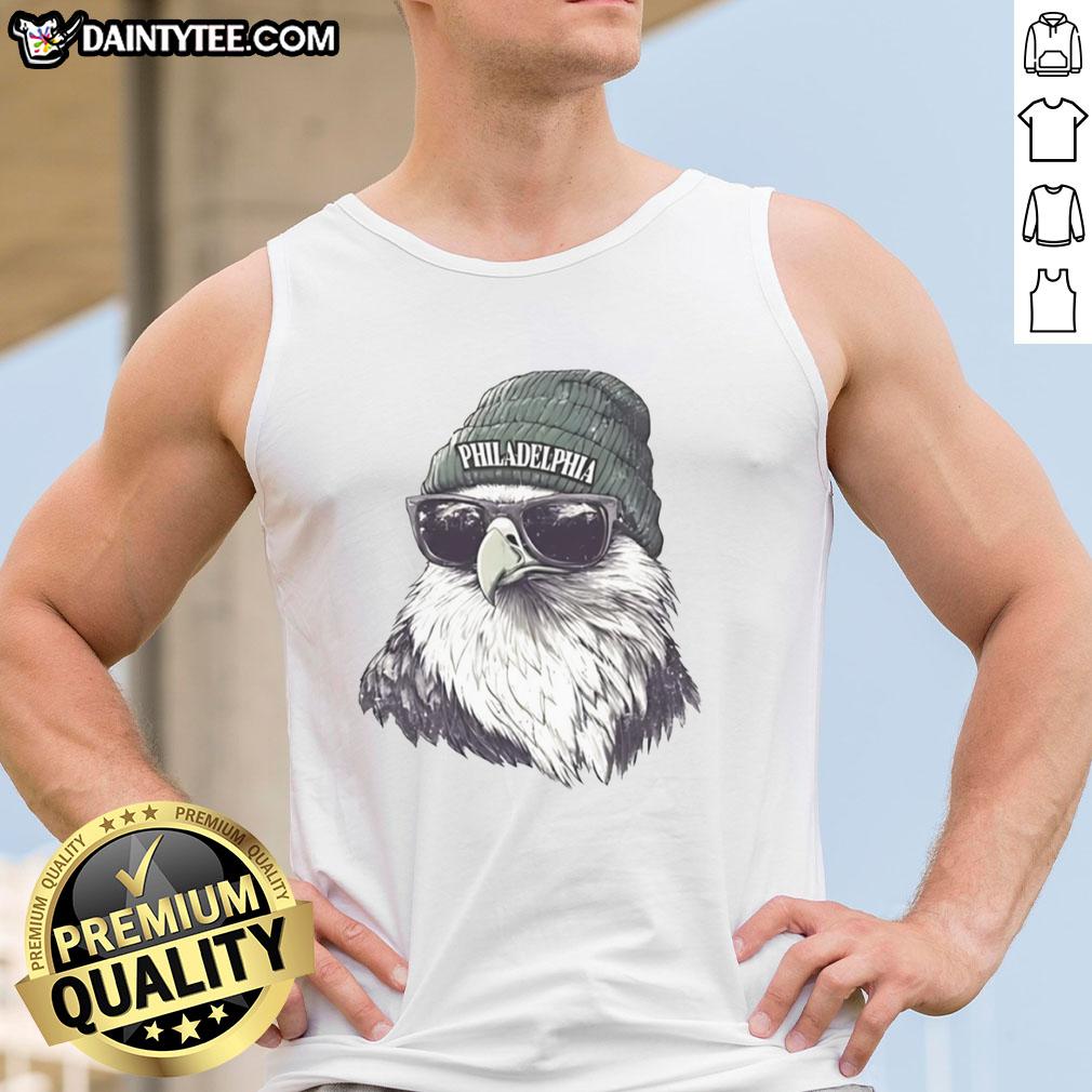Philadelphia Eagles mascot wearing a beanie and sunglasses, showcasing team spirit in a stylish tank top.
