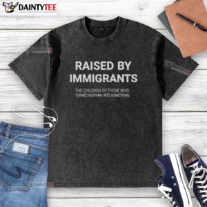Alt Text: Awesome Raised By Immigrants washed t-shirt showcasing the inspiring journey of children turning nothing into something.