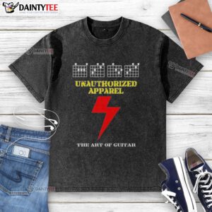 Alt Text: Awesome Unauthorized Apparel The Art of Guitar washed t-shirt featuring a vintage guitar graphic on soft fabric.