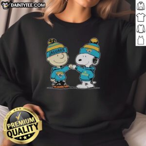 Cute Jacksonville Jaguars Snoopy and Charlie Brown best friends sweatshirt featuring playful design and team colors.