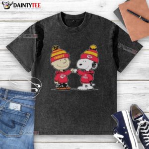 Alt Text: Cute Kansas City Chiefs Snoopy and Charlie Brown best friends graphic on a washed t-shirt for NFL fans.