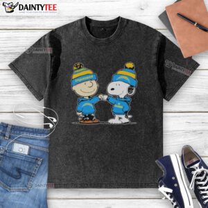 Cute Los Angeles Chargers Snoopy and Charlie Brown best friends graphic on a washed T-shirt, perfect for fans.