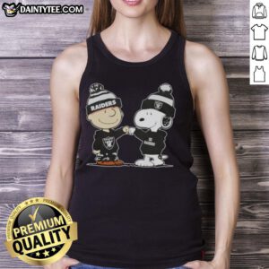 Adorable Charlie Brown and Snoopy fist bump in a Las Vegas Raiders football tank top, perfect for fans and collectors.