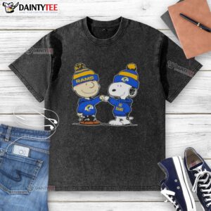 Charlie Brown and Snoopy fist bump in a cute Peanuts design on a Los Angeles Rams football washed t-shirt.