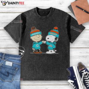 Cute Peanuts Charlie Brown fist bump with Snoopy in Miami Dolphins football washed t-shirt design.