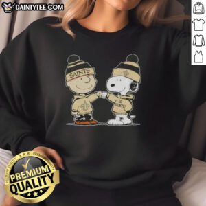 Alt Text: Cute Peanuts Charlie Brown fist bump with Snoopy on New Orleans Saints football sweatshirt design.