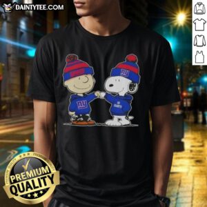 Alt Text: Cute Peanuts Charlie Brown fist bump with Snoopy on New York Giants football T-shirt, perfect for fans.