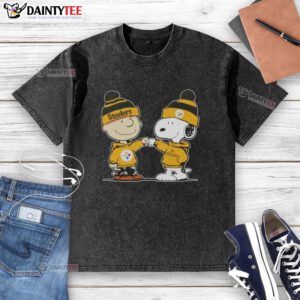 Alt Text: Cute Peanuts Charlie Brown fist bump with Snoopy in Pittsburgh Steelers football t-shirt - playful design.