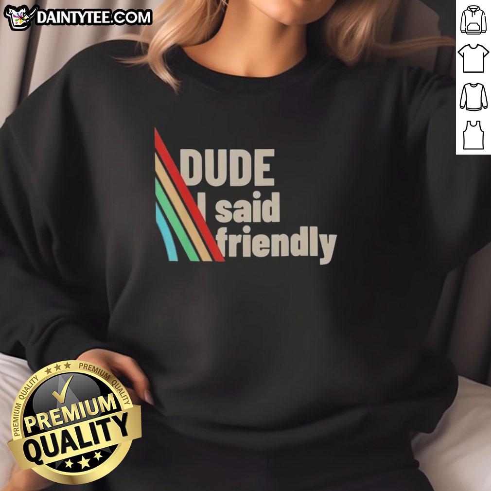 Alt Text: Funny dude wearing a Friendly ARC Raiders sweatshirt, showcasing a playful design and cozy style in casual setting.