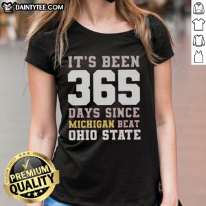 Funny 'It's Been 365 Days Since Michigan Beat Ohio State' ladies tee showcasing team spirit and humor in sports fashion.