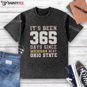 Funny 'It's Been 365 Days Since Michigan Beat Ohio State' washed t-shirt, perfect for college football fans and rivalry supporters.