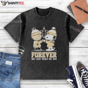 Funny New Orleans Saints X Charlie Brown vs Snoopy graphic on a washed t-shirt, celebrating team spirit beyond just winning.