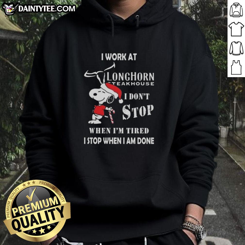 Alt Text: Funny Snoopy hoodie featuring I work at Longhorn Steakhouse, I don't stop when I'm tired, I stop when I'm done.