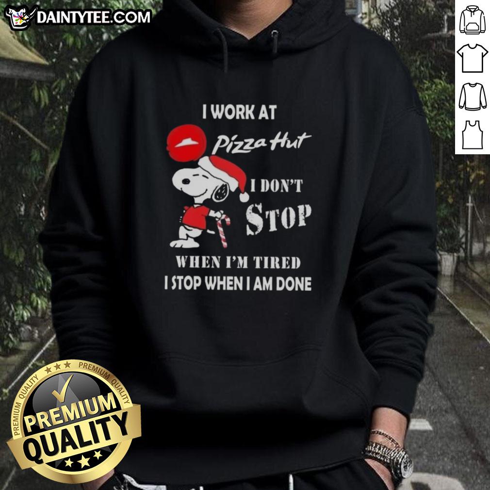 Funny Snoopy Christmas hoodie featuring 'I Work At Pizza Hut, I Don't Stop When I'm Tired' design.