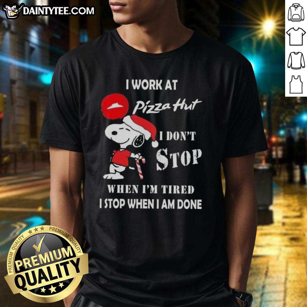 Funny Snoopy Christmas T-Shirt featuring 'I Work At Pizza Hut I Dont Stop When Im Tired, I Stop When I Am Done' slogan.