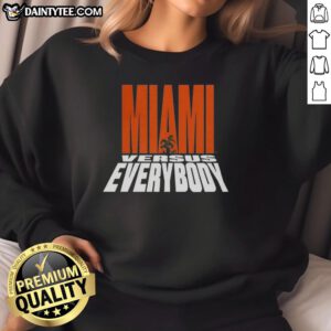 Alt Text: Miami Hurricanes Football sweatshirt featuring the Miami Versus Everybody mascot silhouette design.