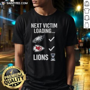 Good Next Victim Loading Lions Hourglass T-Shirt featuring a unique graphic design and bold text for a striking look.