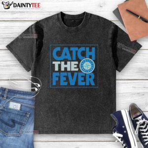 Good Seattle Mariners Catch The Fever washed t-shirt displayed on a hanger, showcasing vibrant team colors and logo.