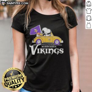 Snoopy and Woodstock riding in a Minnesota Vikings football car logo on a ladies tee shirt.