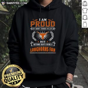 Alt Text: Happy fan wearing a Texas Longhorns hoodie, expressing pride in being a Texas Longhorns fan.