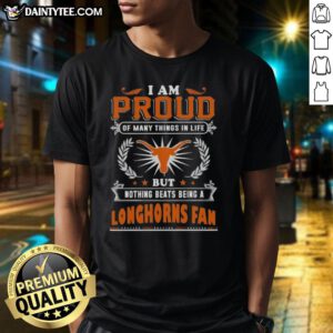 Happy Texas Longhorns fan wearing a 'Proud Of Many Things' T-shirt, showcasing team spirit and pride in Texas football.