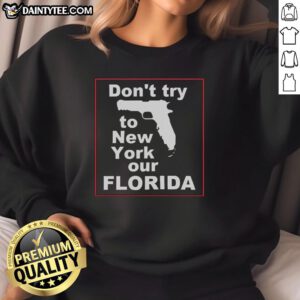 Cozy 'Hot Don't Try to New York Our Florida' sweatshirt displayed on a vibrant background, perfect for Florida lovers.