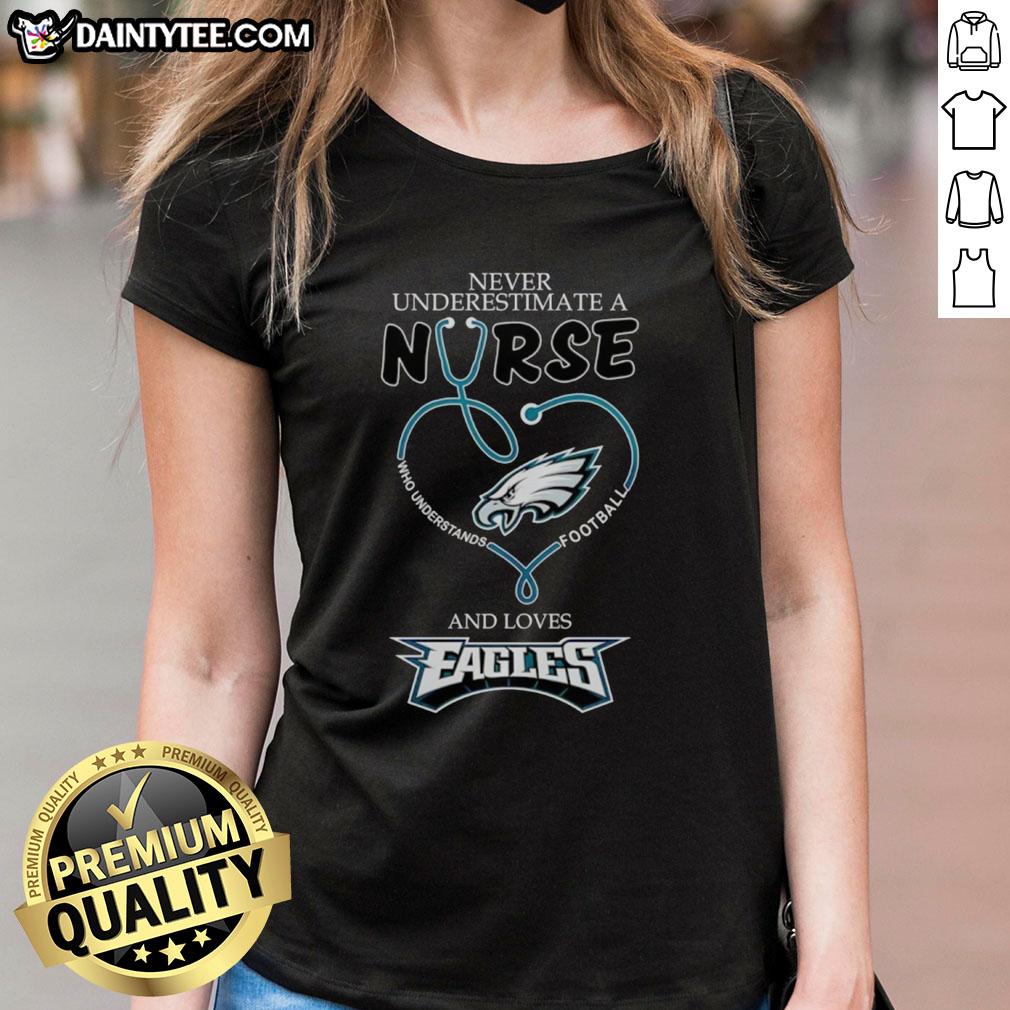 Hot ladies tee featuring 'Never Underestimate a Nurse Who Loves Football' design, perfect for Philadelphia Eagles fans.