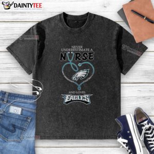 Hot 'Never Underestimate a Nurse Who Understands Football' T-shirt featuring Philadelphia Eagles heart design.