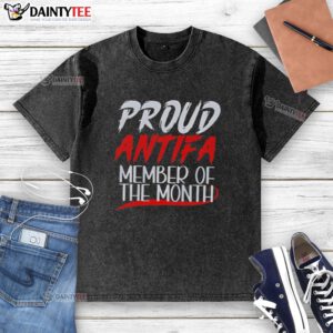 Alt Text: Hot Proud Antifa Member of the Month wearing a washed t-shirt, showcasing activism and style in a vibrant urban setting.