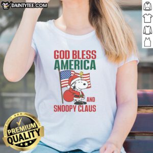 Official Peanuts God Bless America and Snoopy Claus ladies tee featuring festive Snoopy design for patriotic fans.