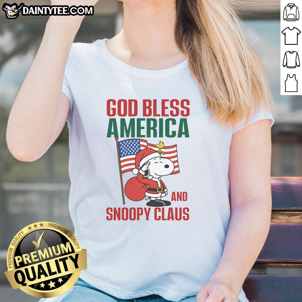 Official Peanuts God Bless America and Snoopy Claus ladies tee featuring festive Snoopy design for patriotic fans.