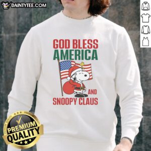 Alt Text: Official Peanuts God Bless America and Snoopy Claus Sweatshirt featuring Snoopy in a festive design for holiday cheer.