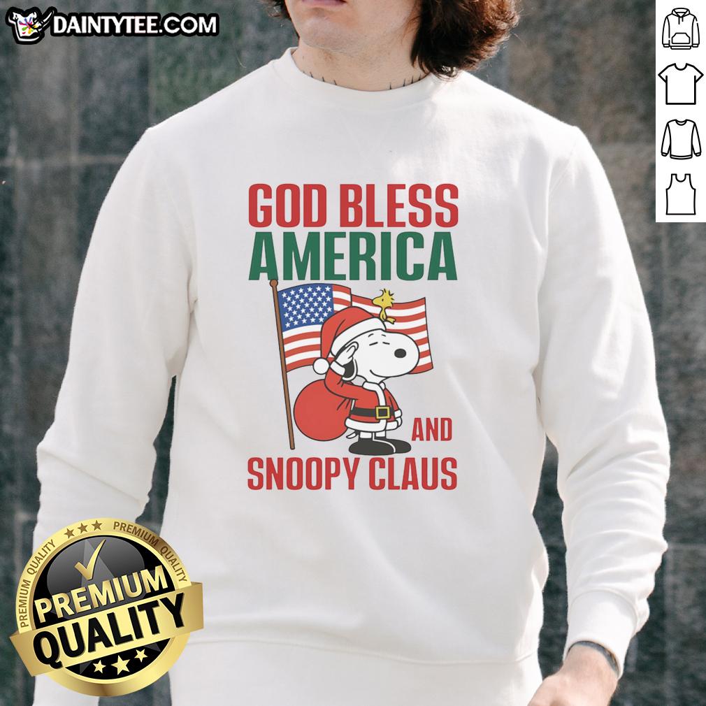 Alt Text: Official Peanuts God Bless America and Snoopy Claus Sweatshirt featuring Snoopy in a festive design for holiday cheer.
