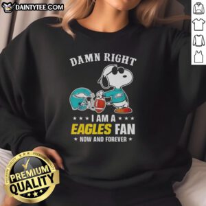 Alt Text: Premium Peanuts Snoopy sweatshirt featuring 'Damn Right I Am an Eagles Fan' design for passionate fans.