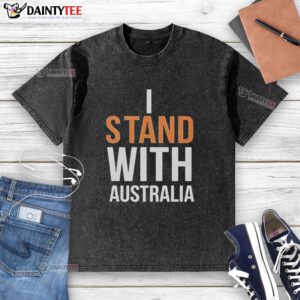 Person wearing 'Stand With Australia' washed t-shirt at Bondi Beach, showcasing beach vibes and support for Australia.
