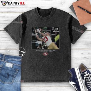 Awesome Christian McCaffrey San Francisco 49ers NFL Wild Card Washed T-Shirt featuring vibrant team colors and design.