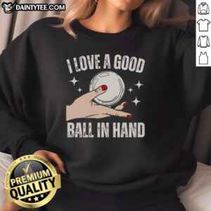 Girl wearing 'I Love a Good Ball in Hand' sweatshirt, showcasing a fun and stylish design for sports enthusiasts.